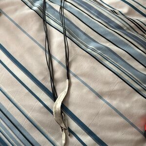 Black corded necklace with faux silver decoration, 18 inch drop. Excel cond